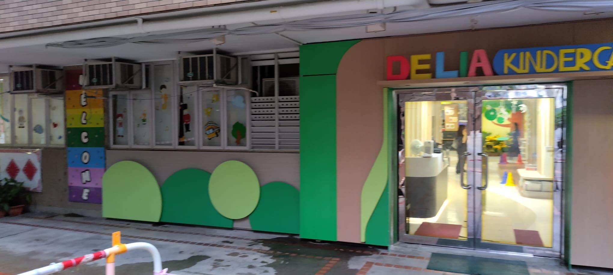 Delia Kindergarten's entrance, with a welcome sign and colourful decorations